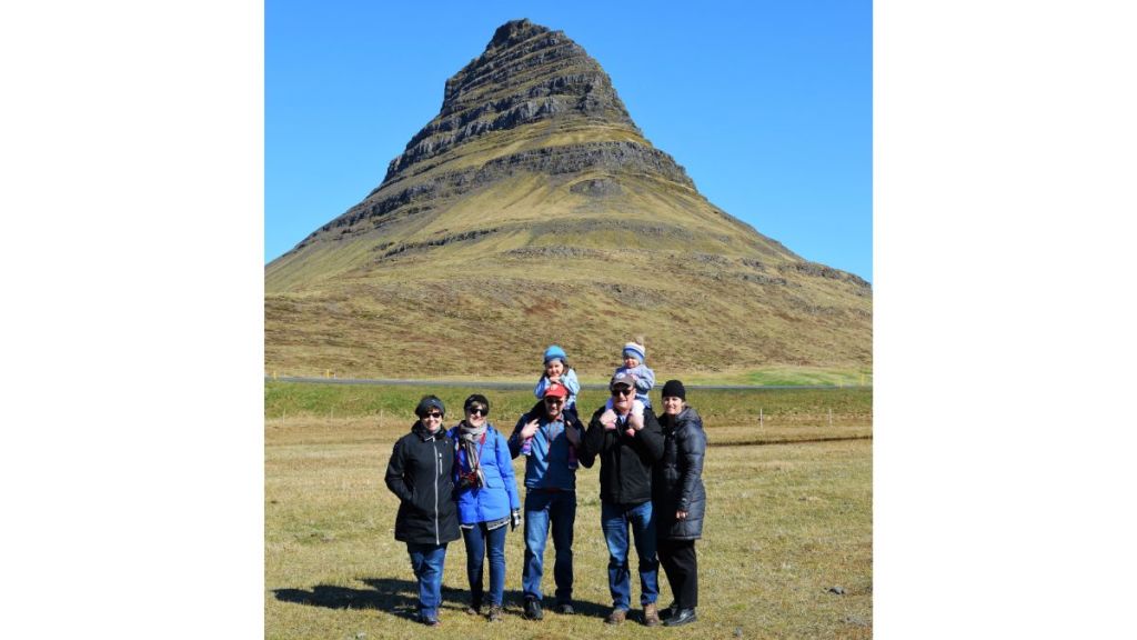 Extended Family standing in front of a mountain in Iceland