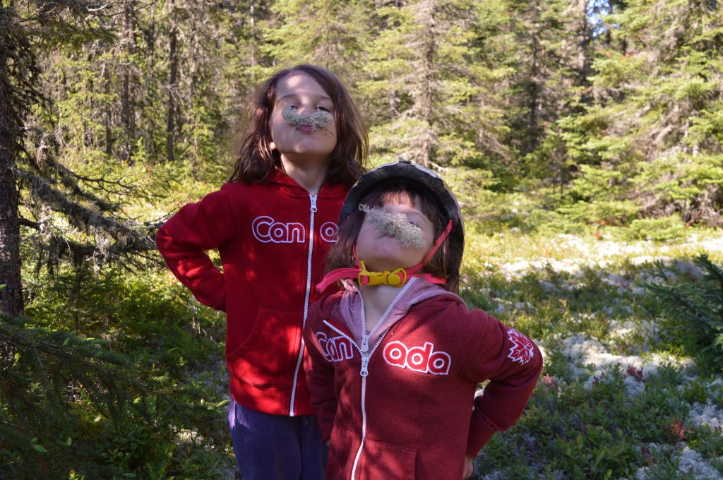 Children with moss on faces