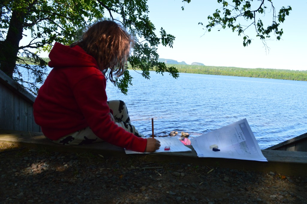 Child homework on shore sleeping giant