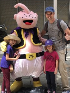 Family Standing with costumed character from DragonBallz