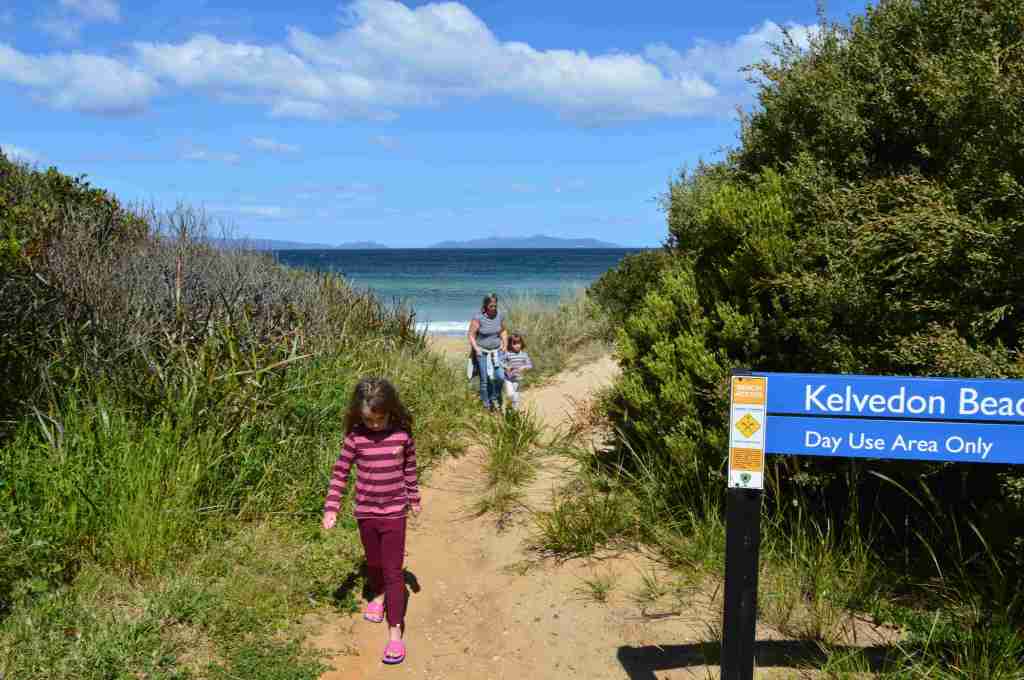 Family walking on a trail at Kelvedon Beach