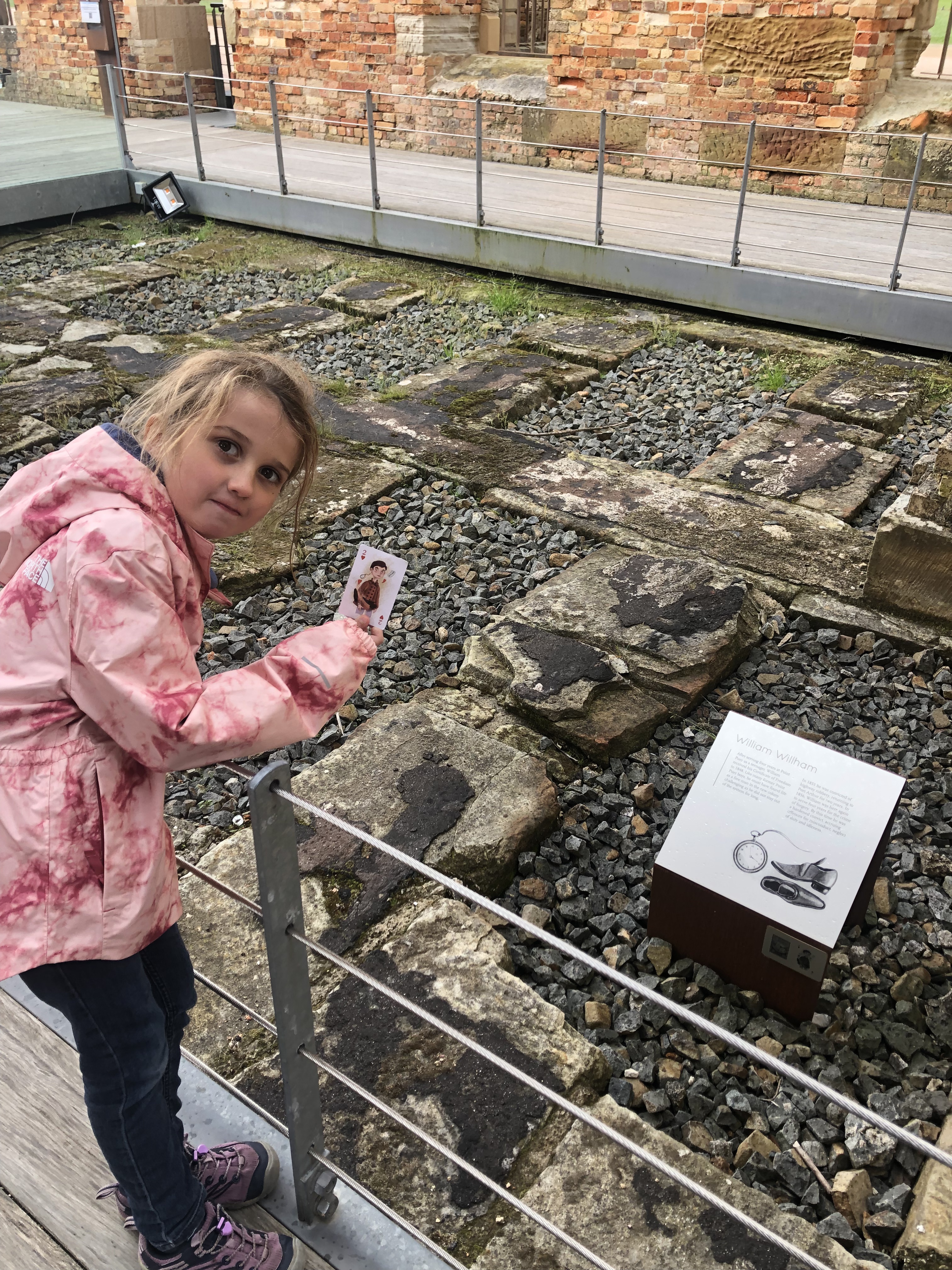 Child with historical placard at Port Arthur