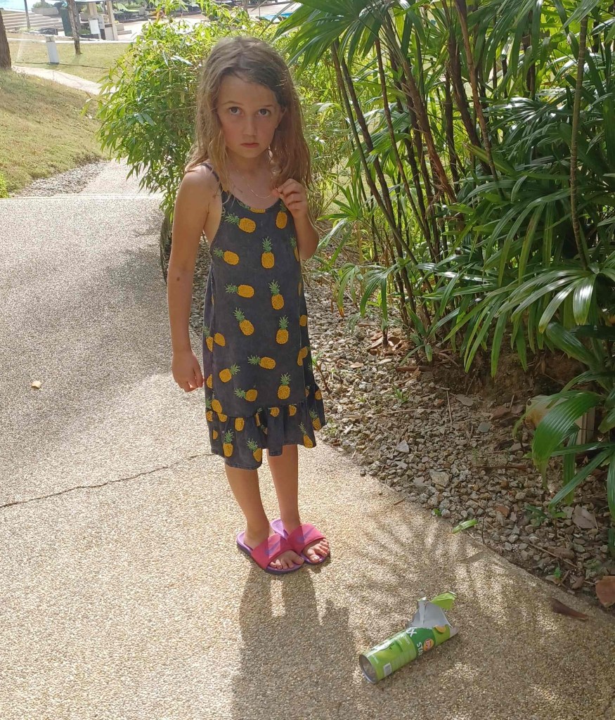 Child with discarded chip container