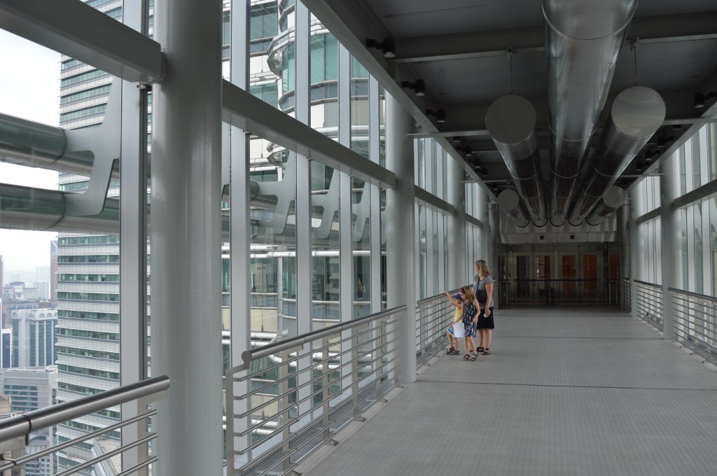Family of three on skywalk Petronas Towers