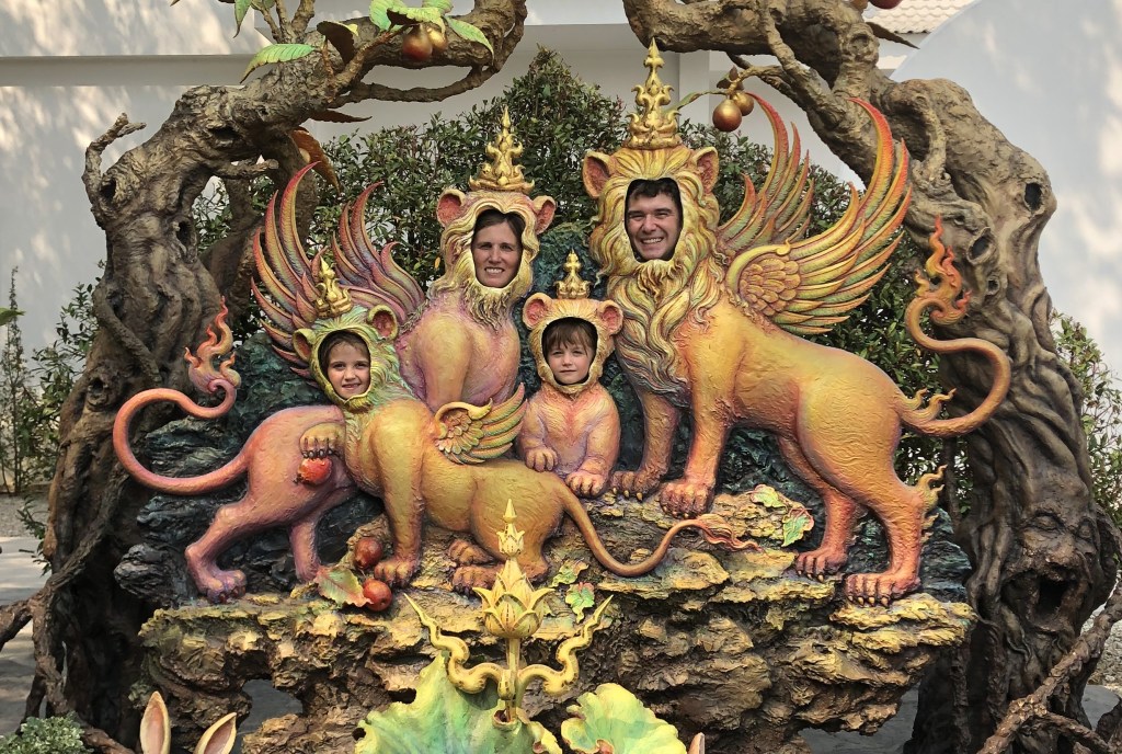 Family with heads in ornate mystical cutout