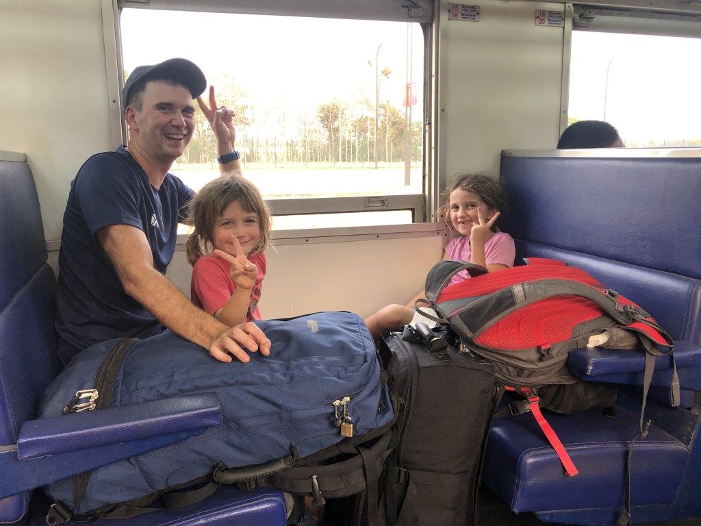 Family peace sign on second class train