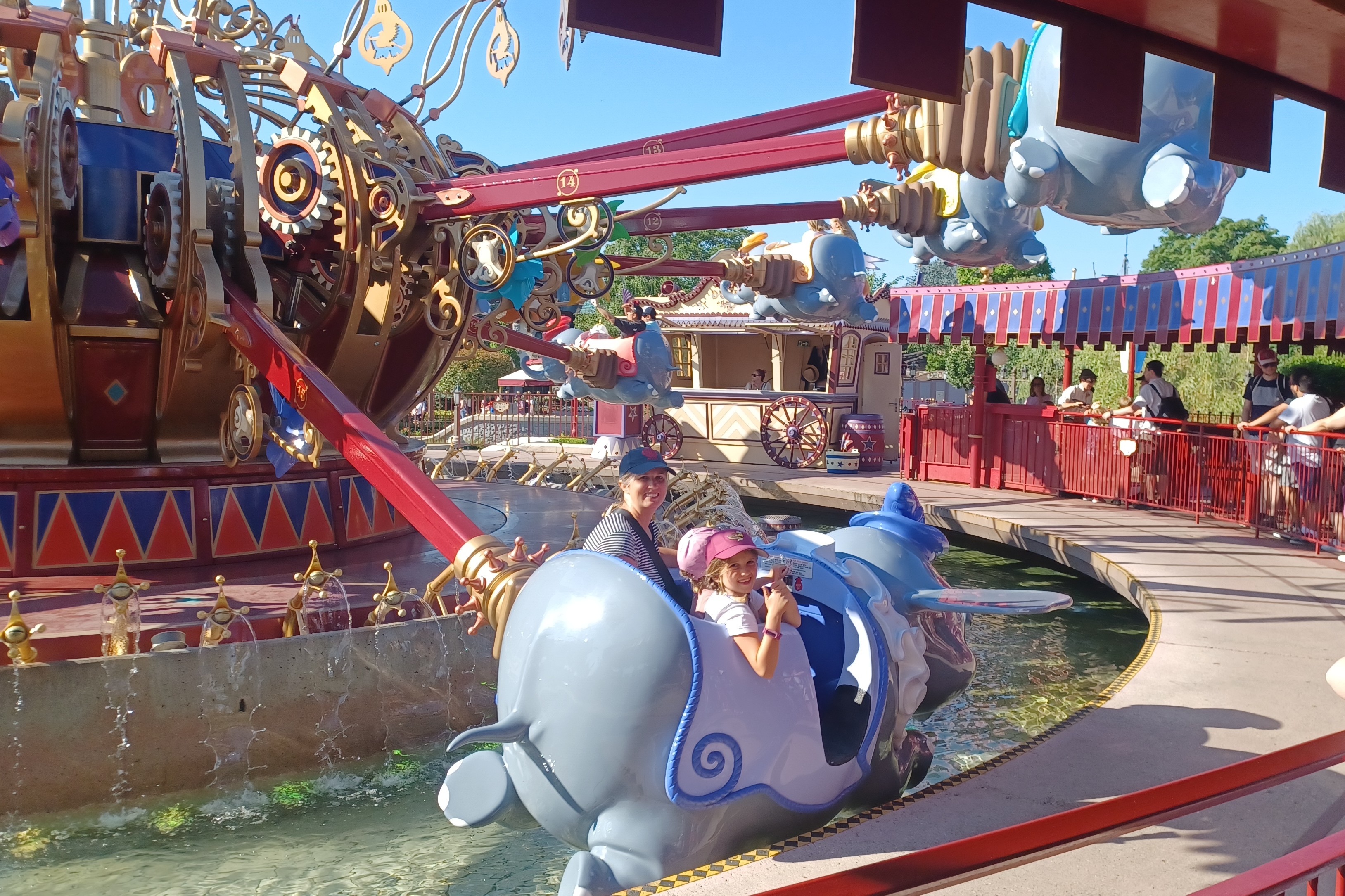 Child and mother riding elephant ride and smiling