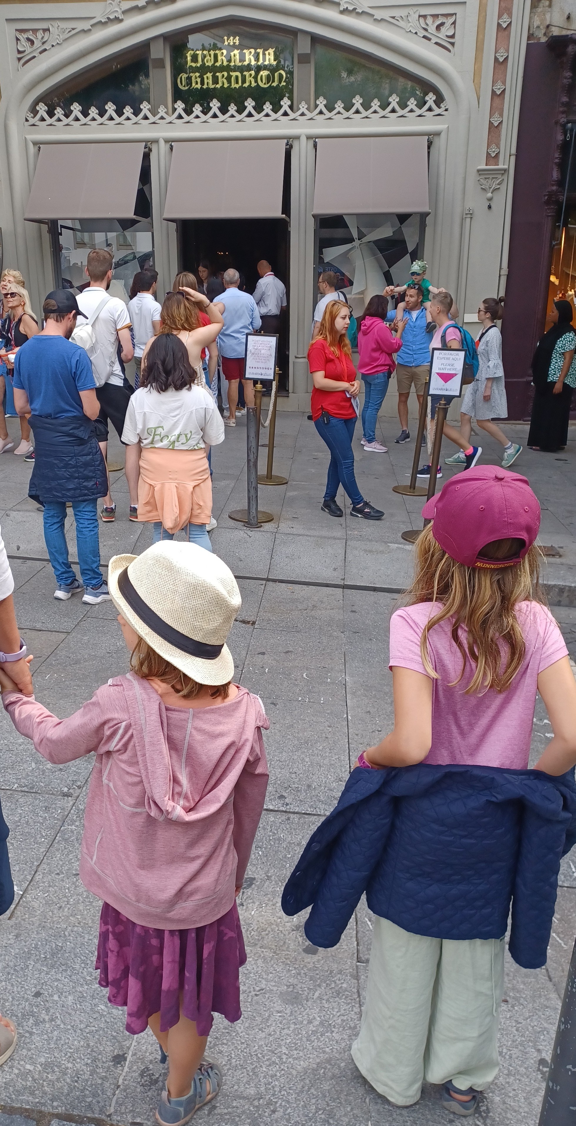 children in queue for admittance to tourist site