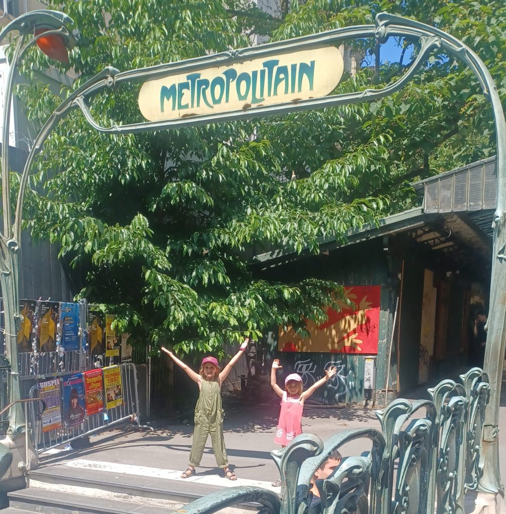 Children under metro sign in paris